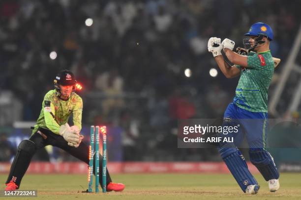 Multan Sultans' Rilee Rossouw is clean bowled during the Pakistan Super League Twenty20 cricket match between Multan Sultans and Lahore Qalandars at...