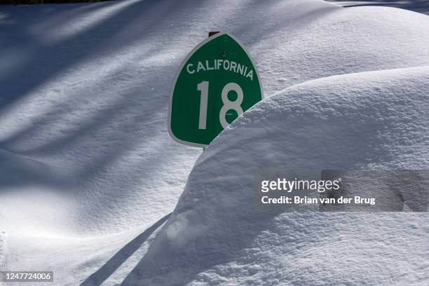 Many street signs are nearly covered as the Big Bear Valley digs out following successive storms which blanketed San Bernardino Mountain communities...