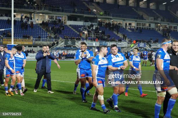 Castres' players react after their victory at the end of the French Top14 rugby union match between Castres Olympique and Lyon Olympique...