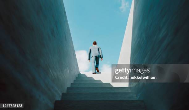 man walks the ladder of success and reaches the top - business growth stock pictures, royalty-free photos & images