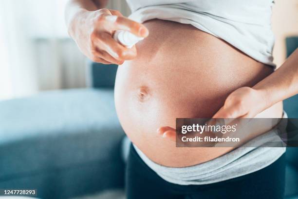 skin care in pregnancy - stretch mark stock pictures, royalty-free photos & images