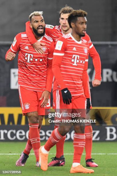 Bayern Munich's Cameroonian forward Eric Maxim Choupo-Moting celebrates scoring the 0-2 goal with his team-mates Bayern Munich's German midfielder...