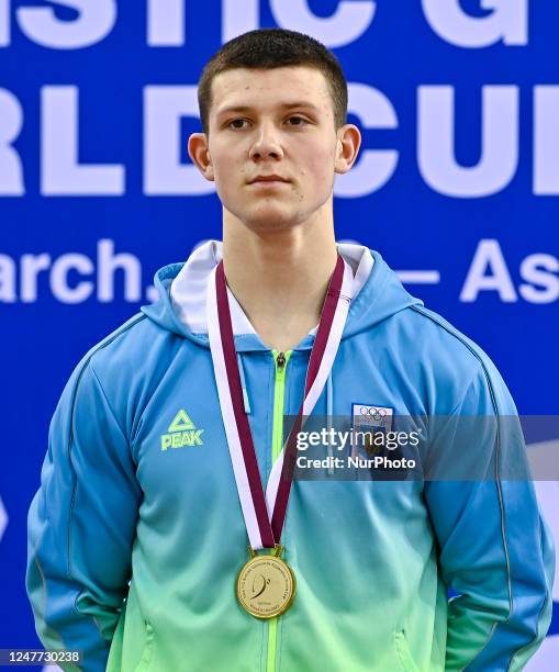 Gold medalist Illia Kovtun of Ukraine poses during the awarding ceremony after the men's parallel bars final at the 15th FIG Artistic Gymnastics...