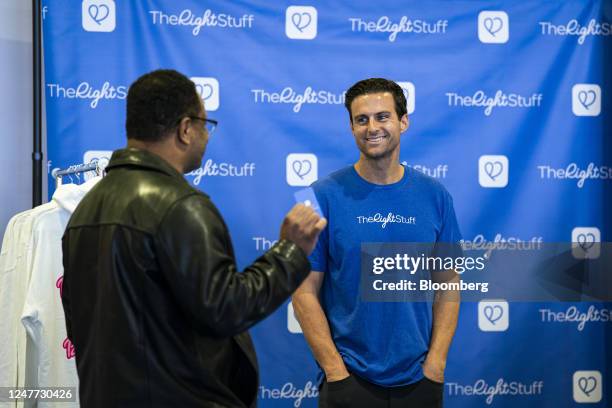 John McEntee, founder of The Right Stuff dating app, speaks with an attendee during the Conservative Political Action Conference in National Harbor,...