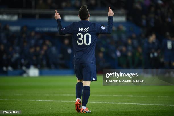 Paris Saint-Germain's Argentine forward Lionel Messi celebrates after scoring a goal during the French L1 football match between Paris Saint-Germain...