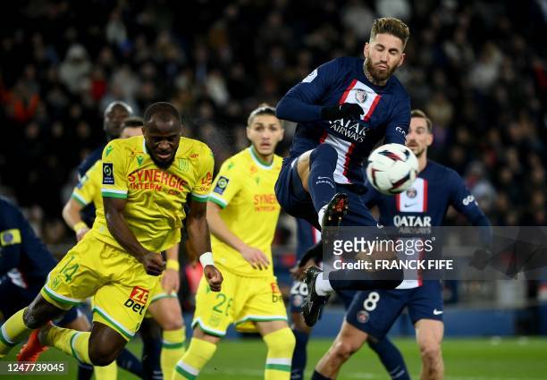 Paris Saint-Germain's Spanish defender Sergio Ramos vies with Nantes' Cameroonian forward Igniatus Ganago during the French L1 football match between...