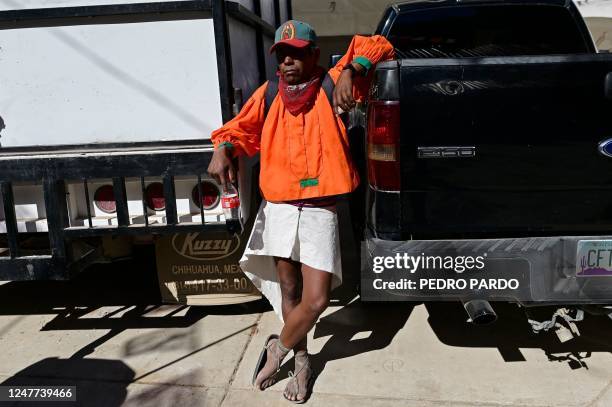 Raramuri runner watches the children's race during the first day of activities of the ultra marathon "Caballo Blanco" in Urique, Chihuahua state,...