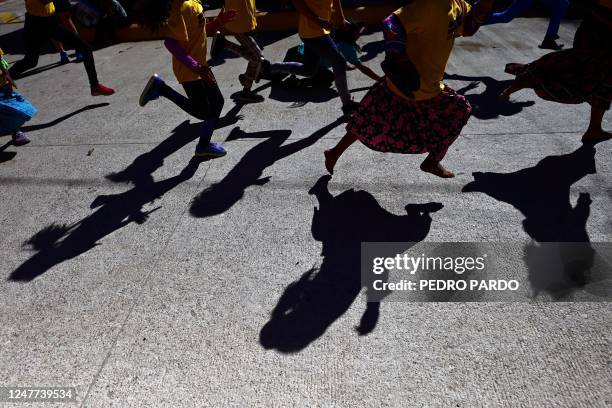 Girls compete in a short race during the first day of activities of the ultra marathon "Caballo Blanco" in Urique, Chihuahua state, Mexico, on March...