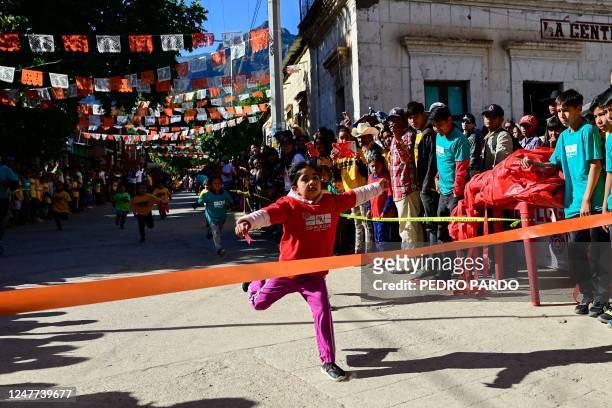 Girls compete in a short race during the first day of activities of the ultra marathon "Caballo Blanco" in Urique, Chihuahua state, Mexico, on March...