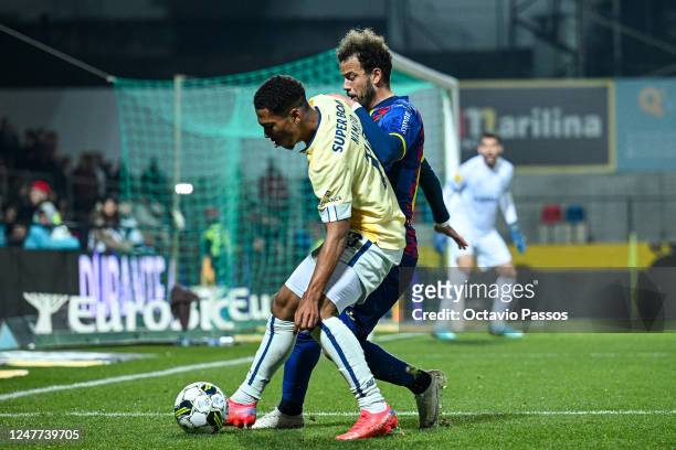Joao Mendes of GD Chaves and Danny Namaso of FC Porto in action during the Liga Portugal Bwin match between GD Chaves and FC Porto at Estadio...