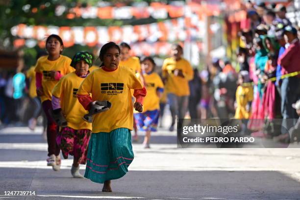 Raramuri girls compete in a short race during the first day of activities of the ultra marathon "Caballo Blanco" in Urique, Chihuahua state, Mexico,...