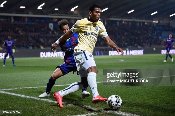 Porto's British forward Danny Namaso Loader vies with Chaves' Portuguese midfielder Joao Pedro during the Portuguese League football match between GD...