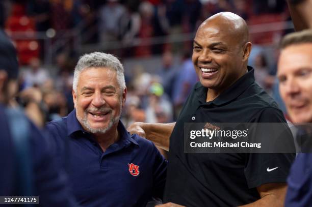 Head coach Bruce Pearl of the Auburn Tigers celebrates with Charles Barkley after defeating the Tennessee Volunteers at Neville Arena on March 04,...