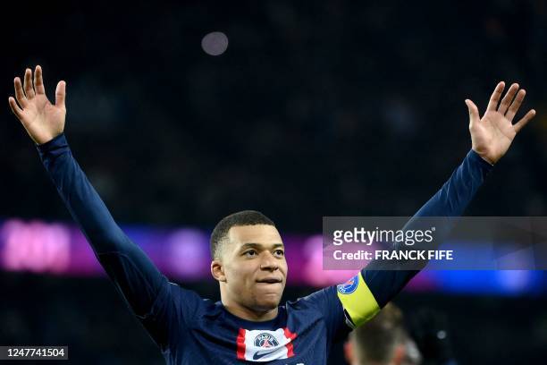 Paris Saint-Germain's French forward Kylian Mbappe celebrates after scoring a goal during the French L1 football match between Paris Saint-Germain...