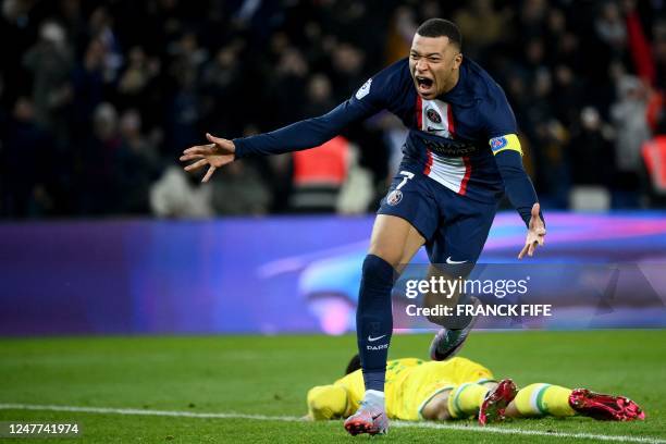 Paris Saint-Germain's French forward Kylian Mbappe celebrates after scoring a goal during the French L1 football match between Paris Saint-Germain...