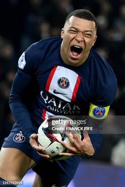 Paris Saint-Germain's French forward Kylian Mbappe celebrates after scoring a goal during the French L1 football match between Paris Saint-Germain...