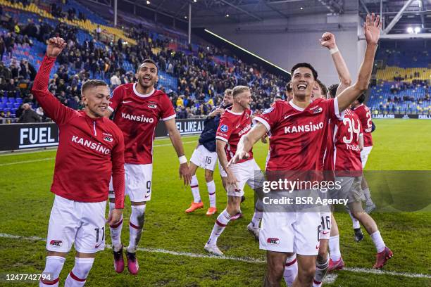 Tijjani Reijnders of AZ, players of AZ celebrate the win during the Eredivisie match between Vitesse and AZ at the GelreDome on March 3, 2023 in...