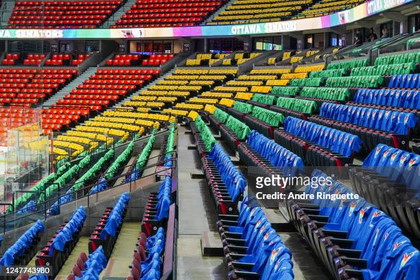 The arena bowl is filled with colored t-shirts on every seat for Pride Night prior to a game between the Ottawa Senators and the Columbus Blue...