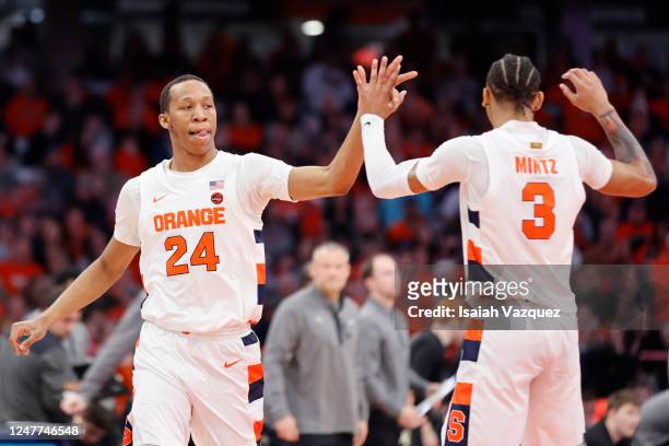 Quadir Copeland of the Syracuse Orange celebrates with Judah Mintz of the Syracuse Orange after a play against the Wake Forest Demon Deacons during...
