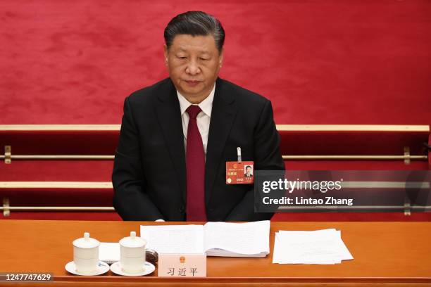 Chinese President Xi Jinping attend the opening of the first session of the 14th National People's Congress at The Great Hall of People on March 5,...