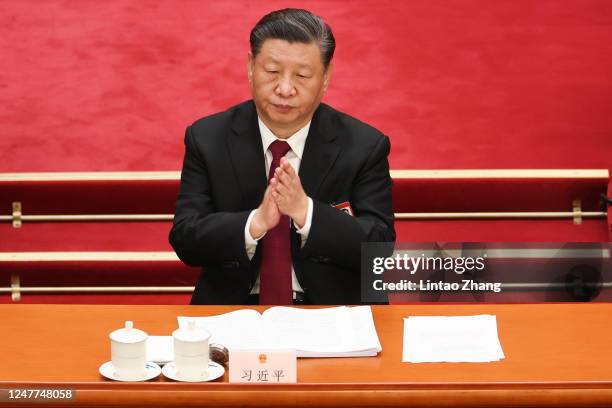 Chinese President Xi Jinping attend the opening of the first session of the 14th National People's Congress at The Great Hall of People on March 5,...