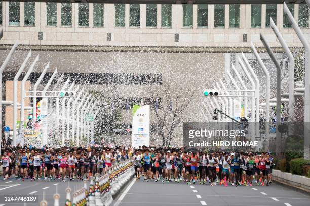Runners fill the street in front of the Tokyo Metropolitan Government Building at the start of the Tokyo Marathon 2023 in Tokyo on March 5, 2023.