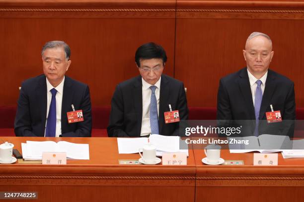 Delegates Wang Yang, Wang Huning, and Cai Qi attend the opening of the first session of the 14th National People's Congress at The Great Hall of...