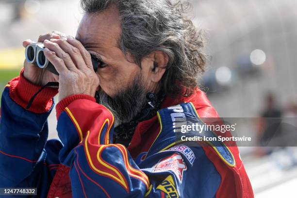 Fan watches the action with binoculars during the NASCAR Xfinity Series Alsco Uniforms 300 on March 4 at Las Vegas Motor Speedway in Las Vegas,...