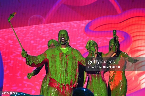 Mia Burleson, Marc D'Amelio, Nate Burleson, Charli D'Amelio, Dixie D'Amelio and Heidi D'Amelio get slimed onstage during the 36th Annual Nickelodeon...