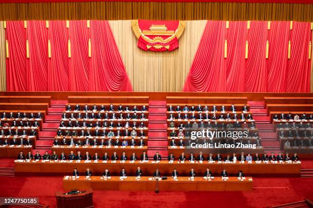 Chinese President Xi Jinping attends the opening of the first session of the 14th National People's Congress at The Great Hall of People on March 5,...