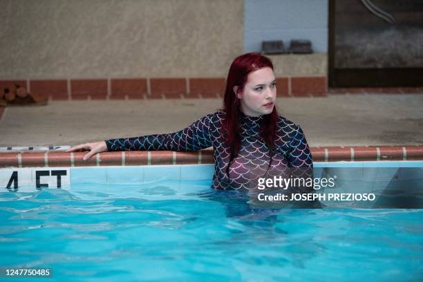 Helena McLeod stands in the water holding her self with the help of the pool wall at the Marriott Dulles Airport in Sterling, Virginia on March 3,...