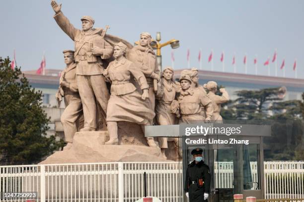 Chinese police officer stands guard at Tiananmen Square during the opening session of the National People's Congress on March 5, 2023 in Beijing,...