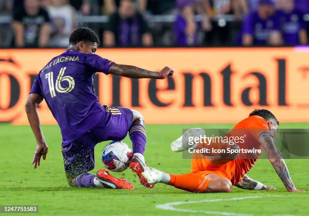 Orlando City midfielder Wilder Cartagena slide tackles the ball away during the MLS soccer match between the Orlando City SC and FC Cincinnati on...