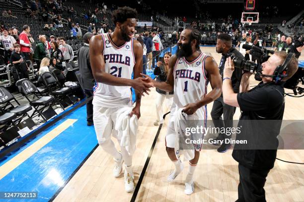 Joel Embiid high fives James Harden of the Philadelphia 76ers after the game against the Milwaukee Bucks on March 4, 2023 at the Fiserv Forum Center...