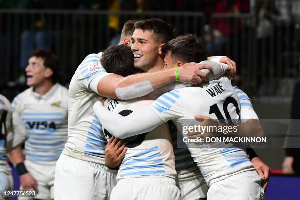 Argentina's Marcos Moneta celebrates with teammates after scoring a try against Fiji during the annual HSBC Canada Rugby Sevens tournament at BC...
