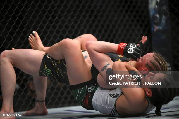 Mexico's mixed martial arts fighter Alexa Grasso fights Kyrgyzstan's mixed martial arts fighter Valentina Shevchenko during their UFC 285 women's...