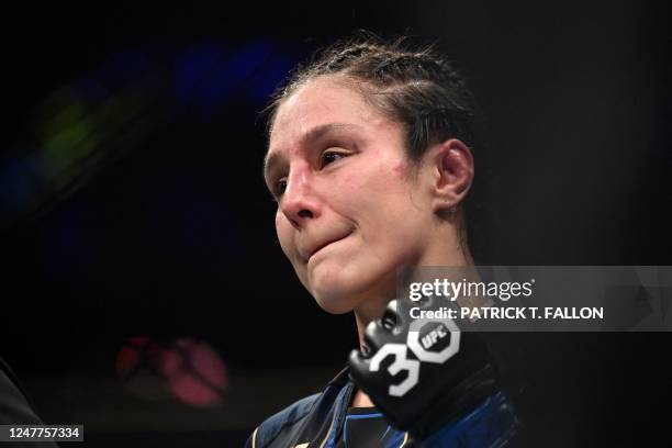 Mexico's mixed martial arts fighter Alexa Grasso celebrates after defeating Kyrgyzstan's mixed martial arts fighter Valentina Shevchenko during their...