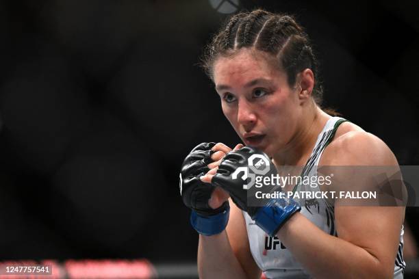 Mexico's mixed martial arts fighter Alexa Grasso fights Kyrgyzstan's mixed martial arts fighter Valentina Shevchenko during their UFC 285 women's...