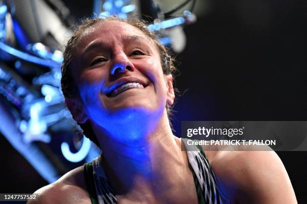 Mexico's mixed martial arts fighter Alexa Grasso celebrates after defeating Kyrgyzstan's mixed martial arts fighter Valentina Shevchenko during their...