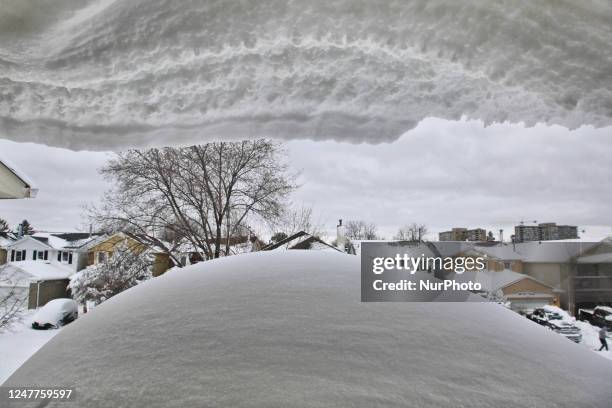 Snow drifts seen on the rooftop of a home following the largest snowstorm of the season in Toronto, Ontario, Canada, on March 04, 2023. Much of...