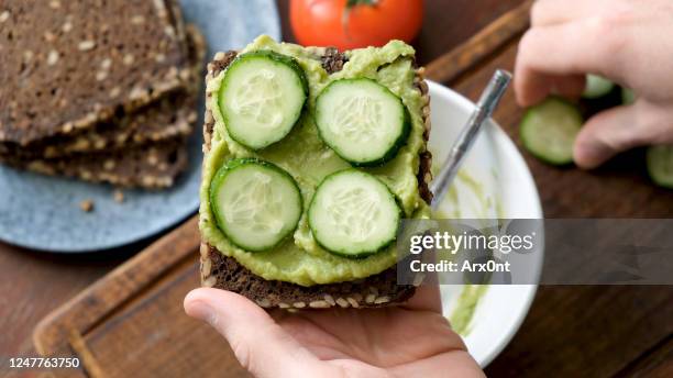 toast with avocado and cucumber - rye bread stock pictures, royalty-free photos & images