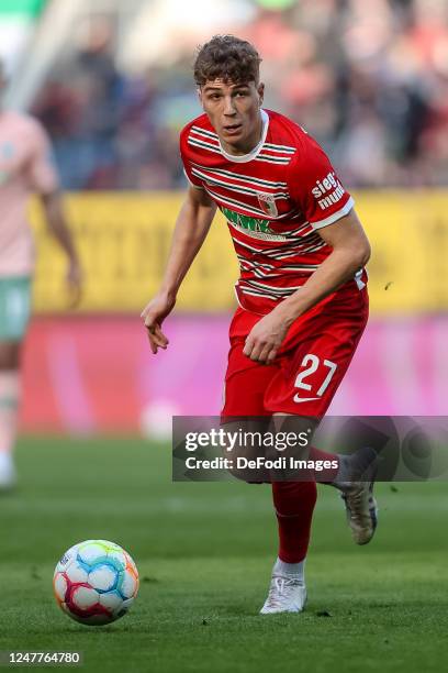 Arne Engels of FC Augsburg controls the ball during the Bundesliga match between FC Augsburg and SV Werder Bremen at WWK-Arena on March 4, 2023 in...