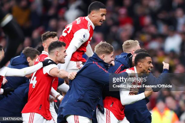 Reiss Nelson of Arsenal celebrates their third goal with his team mates during the Premier League match between Arsenal FC and AFC Bournemouth at...