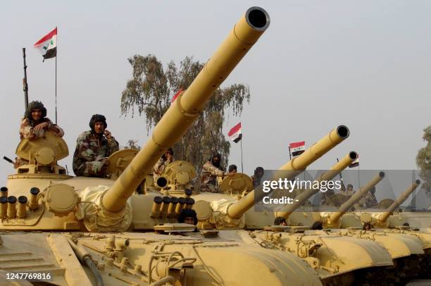 Soviet-design T-72 tanks are seen at an Iraqi military compound north of Baghdad, 17 November 2005. Iraq received last week 77 upgraded and...