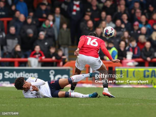 Bolton Wanderers' Shola Shoretire holds his face after a challenge by Morecambe's Jacob Bedeau during the Sky Bet League One between Charlton...