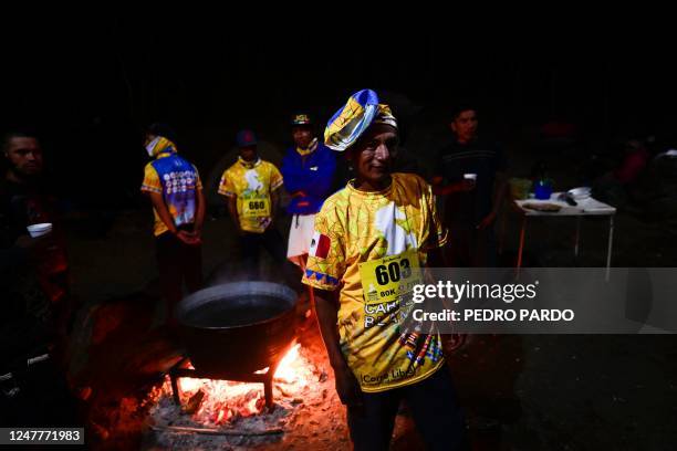 Long-distance runners of the Raramuri community get ready to compete in the ultramarathon "Caballo Blanco" in Urique, Chihuahua State, Mexico, on...