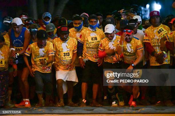 Athletes and long-distance runners of the Raramuri community compete in the ultramarathon "Caballo Blanco" in Urique, Chihuahua State, Mexico, on...