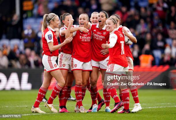 Arsenal players celebrate after Chelsea's Niamh Charles scores an own goal during The FA Women's Continental Tyres League Cup final match at Selhurst...
