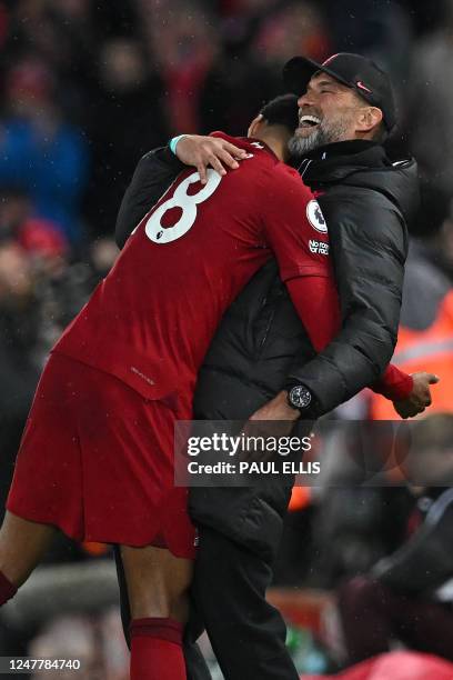 Liverpool's German manager Jurgen Klopp reacts with Liverpool's Dutch striker Cody Gakpo as he is substituted with Liverpool 5-0 up, during the...