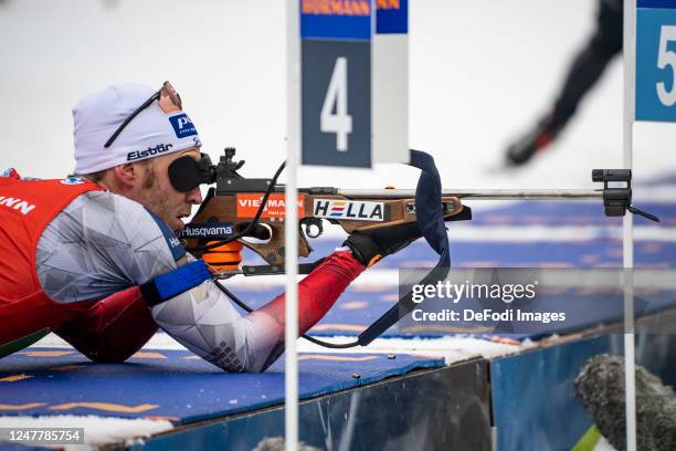 Simon Eder of Austria at the shooting range during the Single Mixed Relay at the BMW IBU World Cup Biathlon Nove Mesto on March 5, 2023 in Nove Mesto...